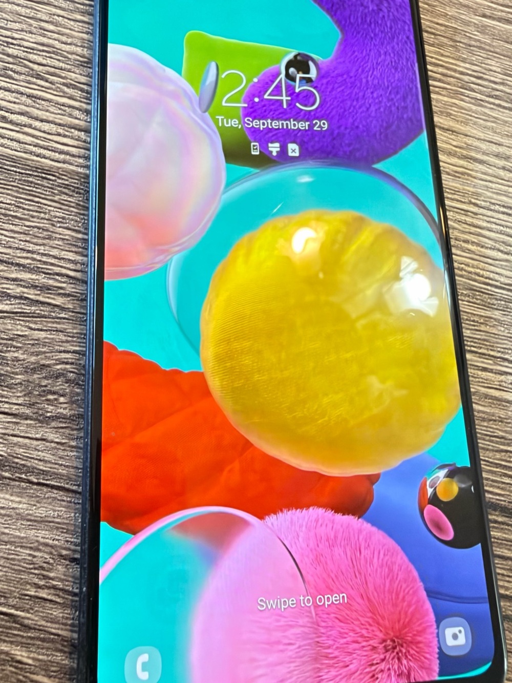 Samsung Smartphone with Black Frame and Vibrant Multicolor Display